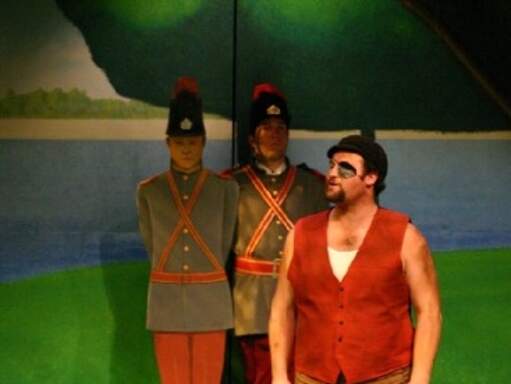 Jeffrey Coyle as the Boatman and Steve Copps as the Soldier