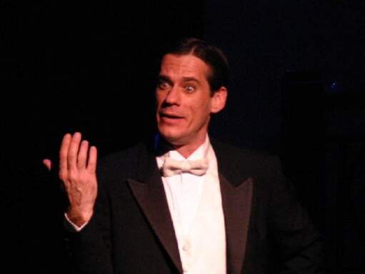 Brian Riggs as Noel Coward